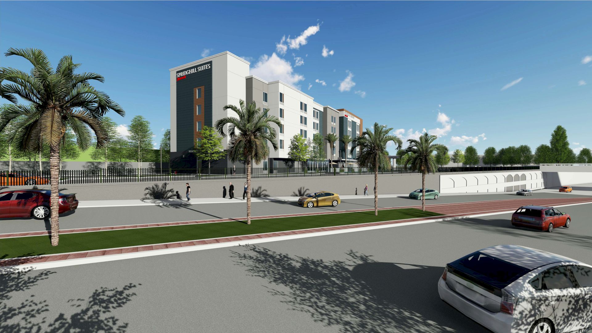 A modern multi-story hotel with palm trees, cars, and people walking along the street on a sunny day.