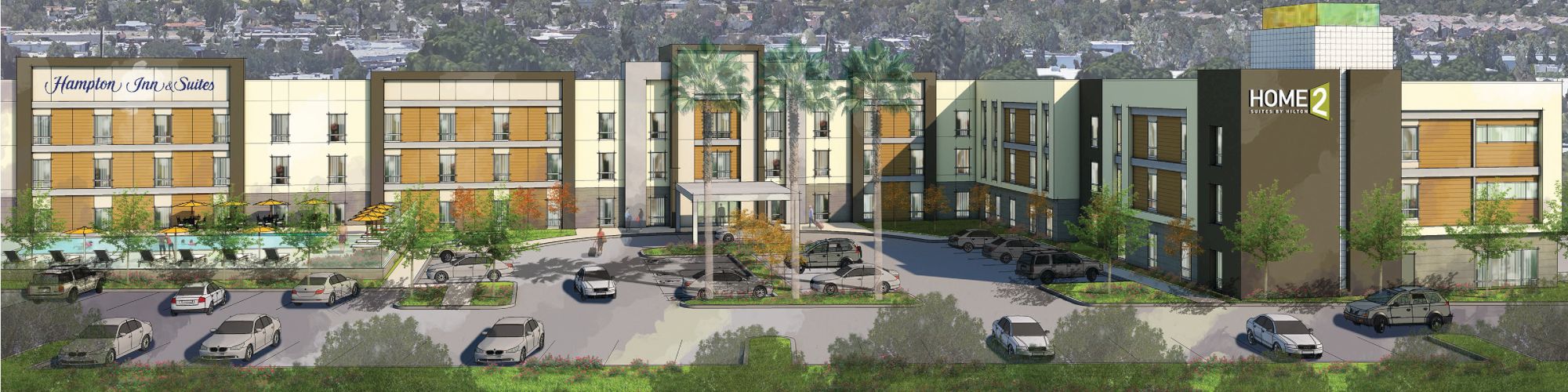 A mid-sized hotel with a parking lot and cars in front, set against a backdrop of mountains and a partly cloudy sky.