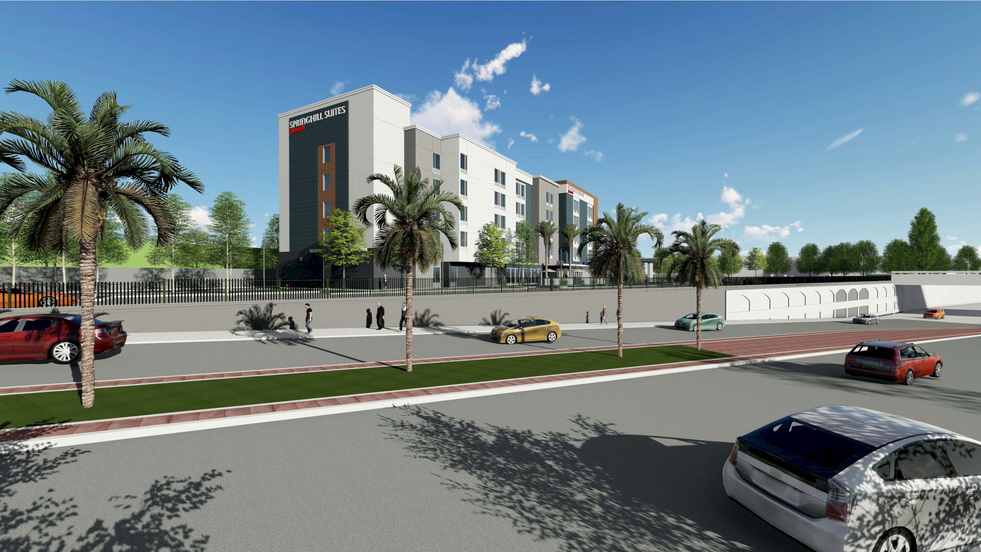 A modern hotel building is seen from across the street, surrounded by palm trees and parked cars, with people walking along the sidewalk.