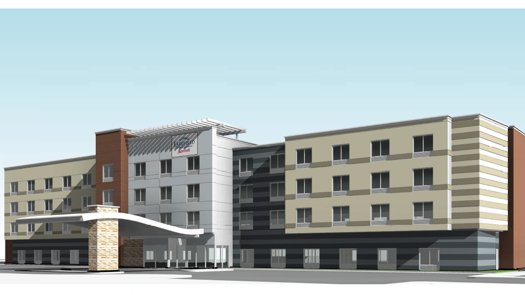 The image shows a modern multi-story hotel with a prominent entrance canopy and a mix of beige and white exterior.